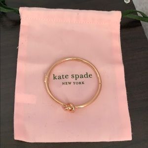 Kate Spade rose gold color bangle.